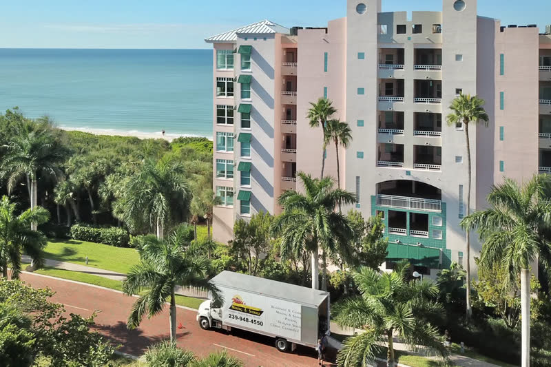 A Florida's moving truck staged outside a waterfront condominium for delivery.